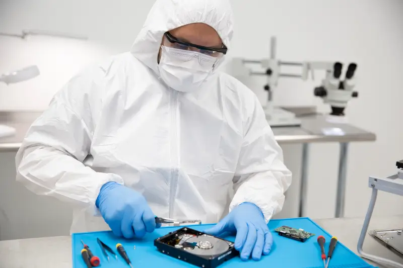 An image of a data recovery engineer preparing to retrieve files from a failed hard drive.