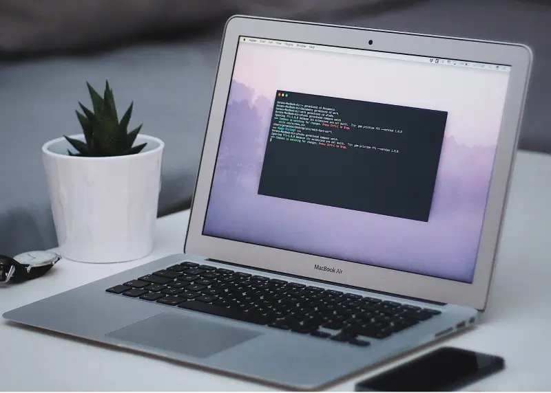 A MacBook running Terminal.