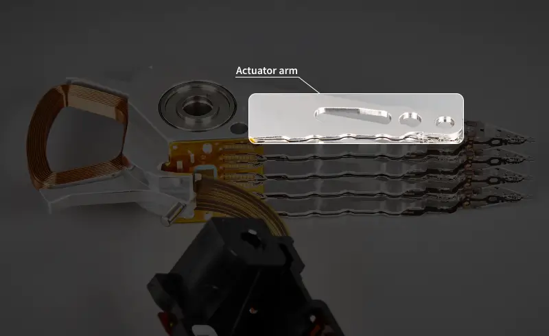An image highlighting the actuator arm of a hard drive.