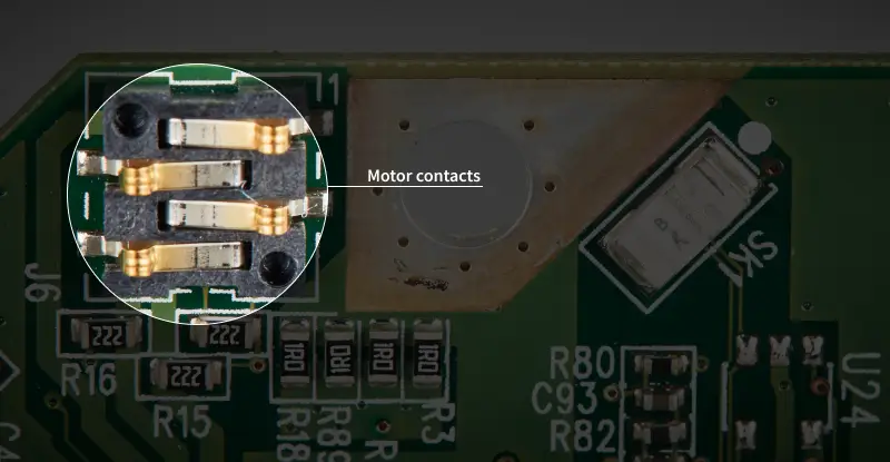 A close-up image showing the motor contacts on the PCB.