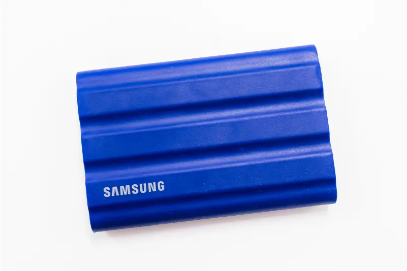 A photo of a Samsung T7 Shield Portable SSD on a blank background.
