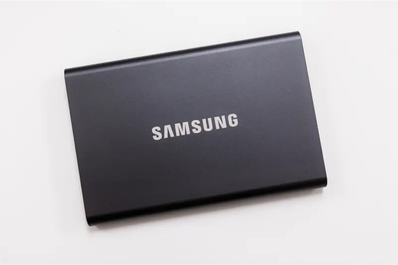 A photo of a Samsung T7 Portable SSD on a blank background.