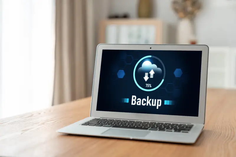 An image of backup software downloading data and uploading files.