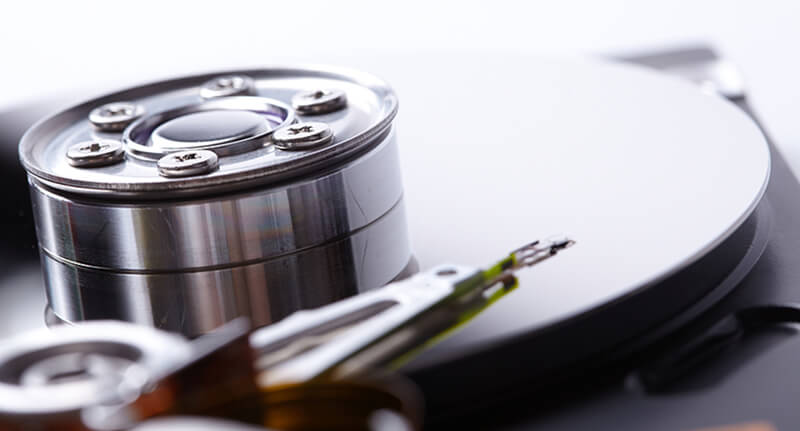 A close-up image of platters in an opened hard drive.