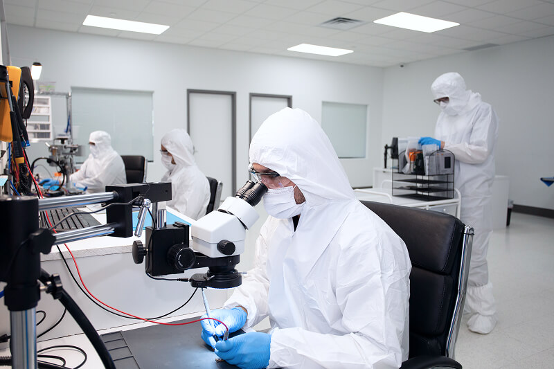 An image of a data recovery engineer working at a soldering station.
