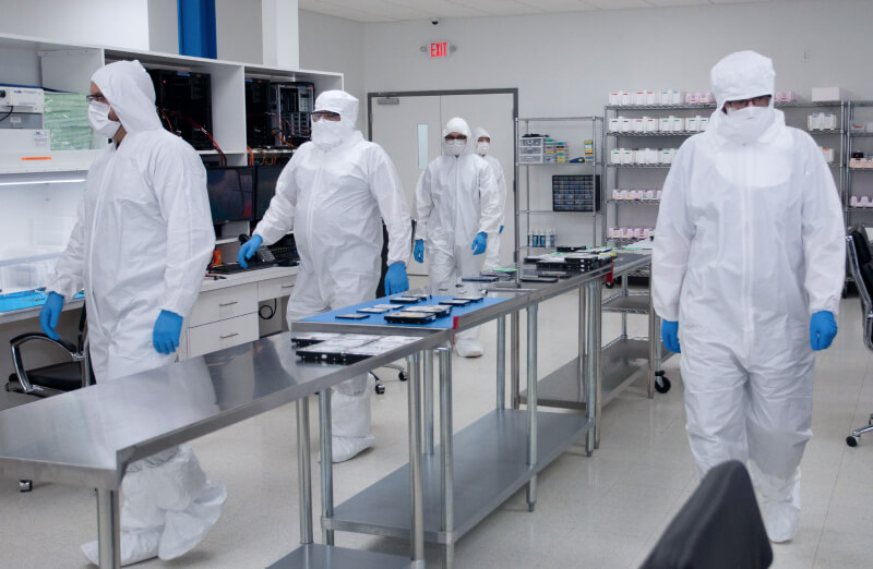 An image of certified data recovery experts in a state-of-the-art cleanroom.