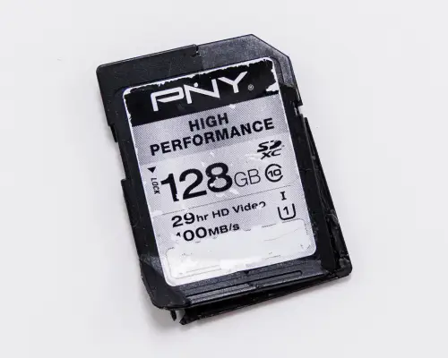 An image of a broken SD card on a blank background.